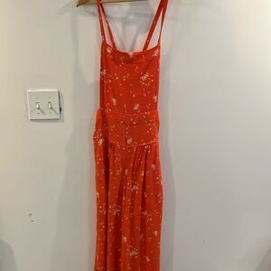 Free people Orange Sweet In The Streets jumpsuit. Size M Preowned